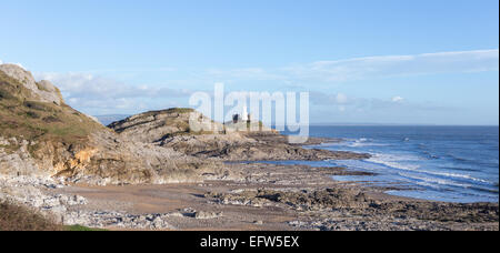Mumbles Lighthouse seen across Bracelet Bay on The South Wales Coast Path, in the Gower Peninsula. Stock Photo