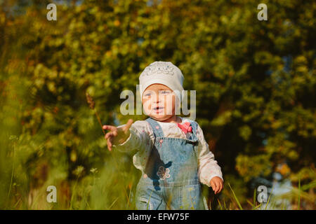 Baby walks in the park Stock Photo