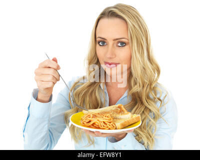 Attractive Young Woman Eating Spaghetti on Toast Stock Photo