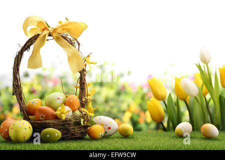 Basket of easter eggs on meadow Stock Photo