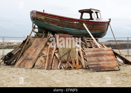 Bonfire ready on Lyme Regis beach, wooden boat on top, November 5th Stock Photo