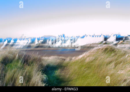 Elie beach at low tide with village through the sand dunes, Elie, East Neuk of Fife, Scotland, U.K. Stock Photo