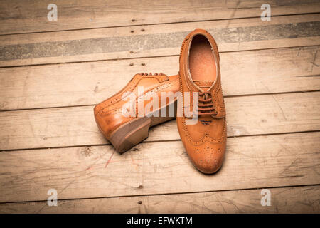 Men Brown Shoes on wooden background Stock Photo