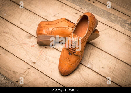 Men Brown Shoes on wooden background Stock Photo