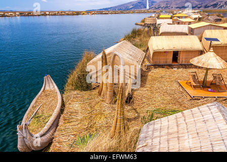 Manmade Uros floating islands and reed boat boat near Puno, Peru on Lake Titicaca
