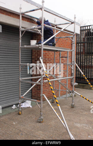 Working on scaffold tower Stock Photo