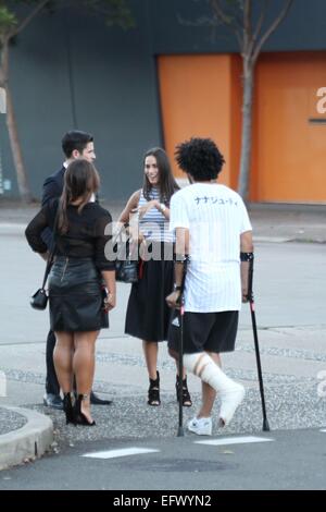 Sydney, Australia. 11 February 2015. Local celebrities attended the Fifty Shades of Grey launch party and exclusive first screening at Moore Park, Sydney. Pictured are TV personality Scott Tweedie and girlfriend model Georgia Berg talking with Krit Schmidt as they arrive. Credit: Richard Milnes/Alamy Live News Stock Photo