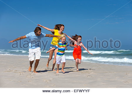 Boy running with arms outstretched pretending to be airplane Stock ...