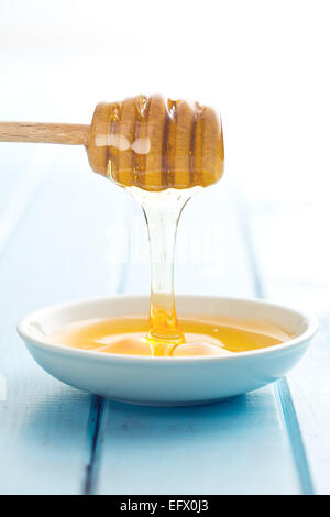 the sweet honey on dipper Stock Photo