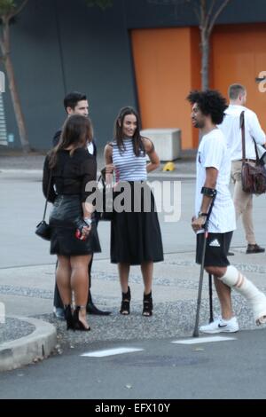 Sydney, Australia. 11 February 2015. Local celebrities attended the Fifty Shades of Grey launch party and exclusive first screening at Moore Park, Sydney. Pictured are TV personality Scott Tweedie and girlfriend model Georgia Berg talking with Krit Schmidt as they arrive. Credit: Richard Milnes/Alamy Live News Stock Photo