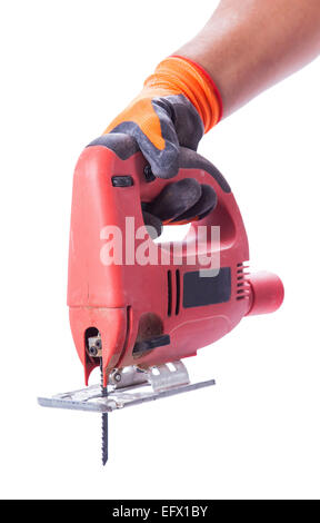 hand in a glove holds a working electric jig saw isolated white background Stock Photo