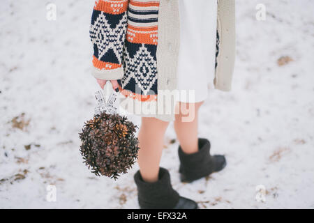 Bride holding wedding bouquet made of pine cones Stock Photo