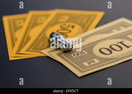 February 8, 2015 - Houston, TX, USA.  Monopoly car and money Stock Photo