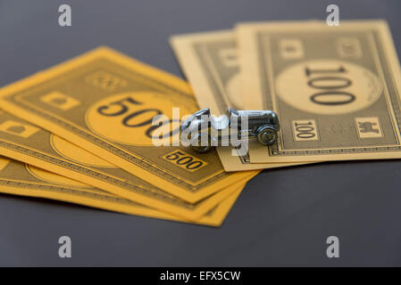 February 8, 2015 - Houston, TX, USA.  Monopoly car and money Stock Photo