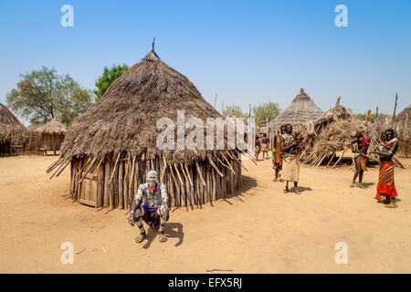 A Village Elder From The Karo Tribe Outside His Home, Kolcho Village, The Lower Omo Valley, Ethiopia Stock Photo