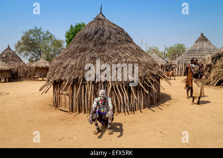 A Village Elder From The Karo Tribe Outside His Home, Kolcho Village, The Lower Omo Valley, Ethiopia Stock Photo