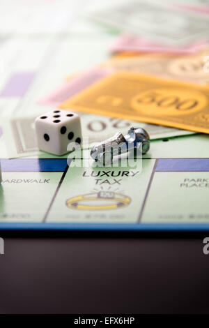 Monopoly board game and luxury tax Stock Photo - Alamy