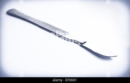 surgical scalpel on average light background Stock Photo