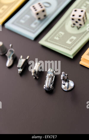 February 8, 2015 - Houston, TX, USA.  Monopoly  playing pieces and money Stock Photo