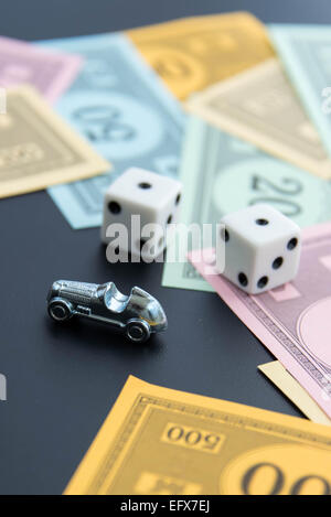 February 8, 2015 - Houston, TX, USA.  Monopoly car, dice and money Stock Photo