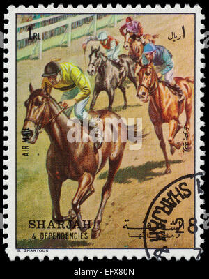 SHARJAH AND DEPENDENCIES - CIRCA 1972: stamp printed by Sharjah and Dependencies, shows horseracers, circa 1972 Stock Photo