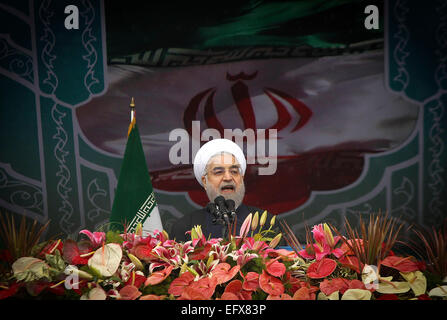 (150211) -- TEHRAN, Feb. 11, 2015 (Xinhua) -- Iran's President Hassan Rouhani speaks during a rally to mark the 36th anniversary of the Islamic revolution at Azadi (liberty) Square in Tehran, Iran, on Feb. 11, 2015. The West should lift 'inhumane and illegal sanctions' against Iran as they try to reach a comprehensive nuclear deal with Tehran, Rouhani said on Wednesday as the country celebrated the 36th anniversary of the Islamic revolution. (Xinhua/Ahmad Halabisaz) Stock Photo