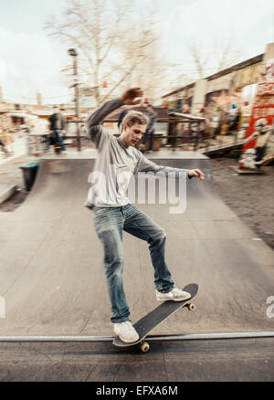 Skateboarding on mini ramp, 5-0 grind, Berlin, Germany Stock Photo