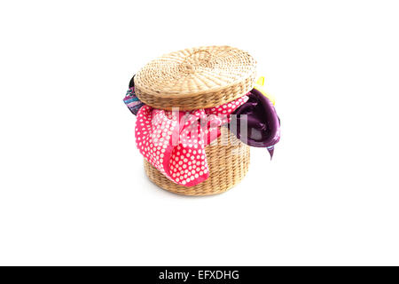 Basket filled with laundry on a white background Stock Photo