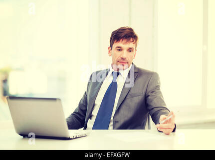 businessman with laptop computer and documents Stock Photo