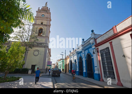 Horizontal street view of Calle Cisneros with the Iglesia Bautista cathedral in Camaguey, Cuba. Stock Photo