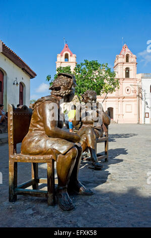 Vertical close up of lifelike comical bronze statues in Camaguey, Cuba. Stock Photo