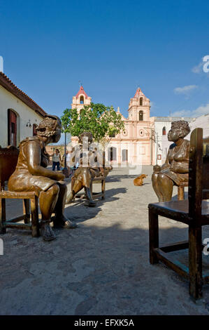 Vertical close up of lifelike comical bronze statues in Camaguey, Cuba. Stock Photo