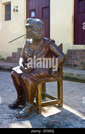 Vertical close up of lifelike comical bronze statue in Camaguey, Cuba. Stock Photo