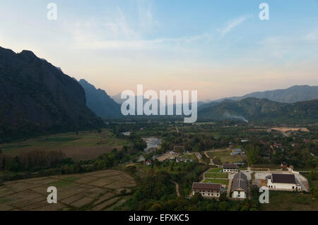 Horizontal aerial view of the picturesque landscape around Vang Vieng at sunset. Stock Photo