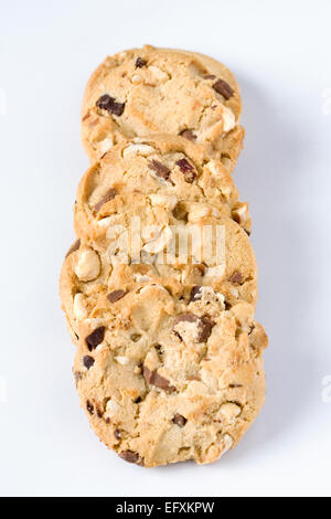 Four chocolate chip and nut cookies on a white background. Stock Photo