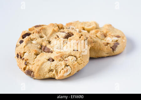 Two chocolate chip and nut cookies on a white background. Stock Photo
