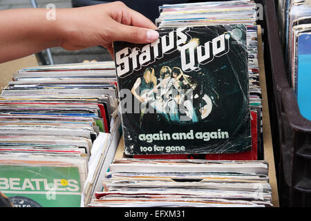 BELGIUM - JULY 2014  Single record of the English rock band Status Quo, again and again, on a flea market Stock Photo