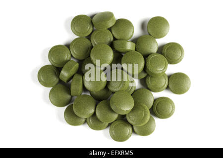 A pile of Chlorella pills. Can be used as background.Chlorella is a genus of single-celled green algae and is a complete protein Stock Photo