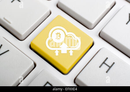 Golden bitcoin to cloud enter key on keyboard Stock Photo