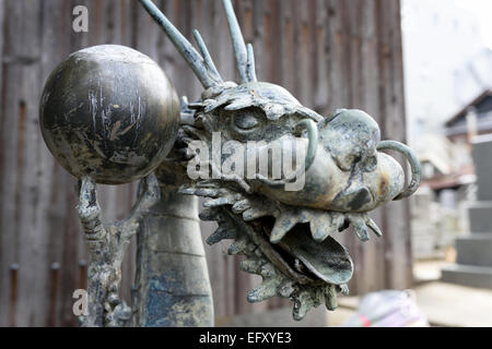 dragon statue holding a ball in his claws　 Stock Photo