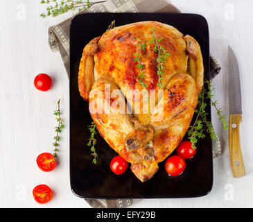 whole roasted chicken on plate. Selective focus