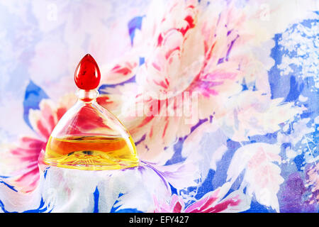 Perfume on  flowery background Stock Photo