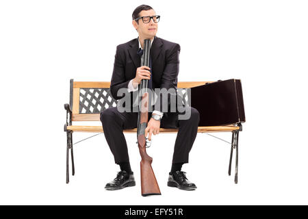 Desperate businessman ready to commit suicide isolated on white background Stock Photo