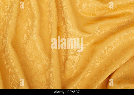 Gold damask floral fabric wavy texture background Stock Photo