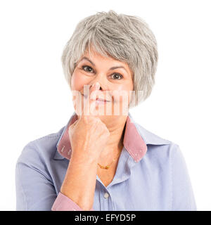Portrait of a elderly woman making a funny face Stock Photo