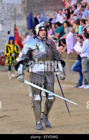 Knight in armor at the parade before the historical horse race Palio di Siena, Piazza del Campo, Siena, Tuscany, Italy Stock Photo