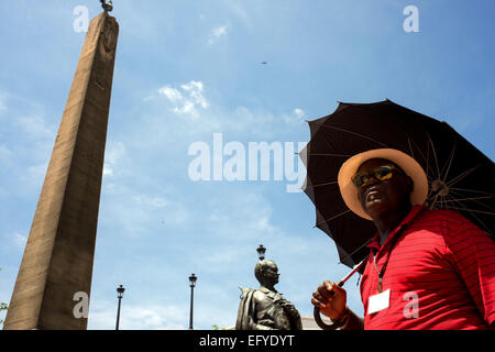 A guide walking arround Obelisk with the French rooster on Plaza de Francia square in Panama City, Panama, Central America. Fren Stock Photo