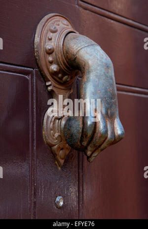 London door knocker in the shape of a human hand Stock Photo