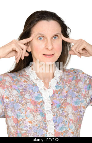 An astonished adult woman with the fingers on the temple, has just got an unbelievable idea Stock Photo