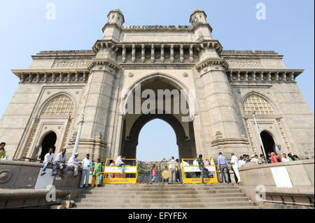 Mumbai, India - 5 january 2015: People walking and resting in front of Gateway of India at Mumbai, India Stock Photo